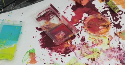 Cute child playing with paints making quite a mess Stock Footage 75635053