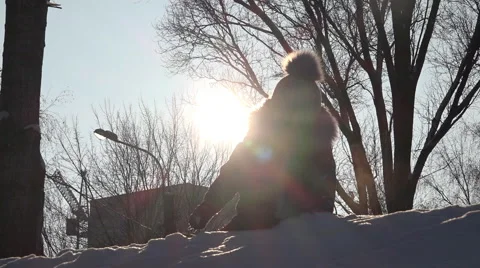 Cute Child Playing in Snow in Winter. Sunny day Stock Footage 60243249