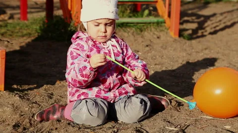 Cute child plays in the playground. Stock Footage 68399532