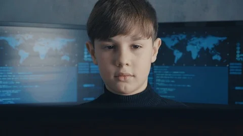 Cute child prodigy developing app. Cute kid young programmer working on computer Stock Footage 102070800