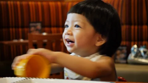 Cute child in restaurant Stock Footage 90488451