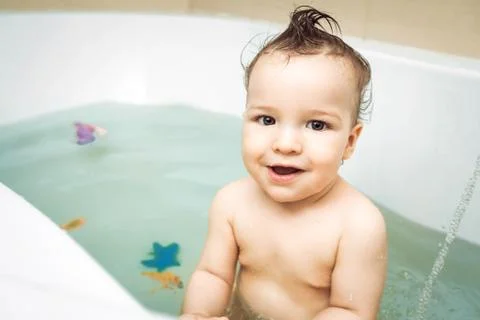Cute child taking bath Stock Photos