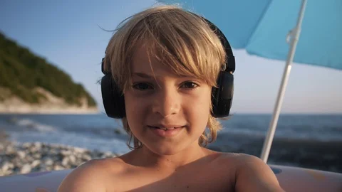 Cute child using smart phone on beach Stock Footage 111834377