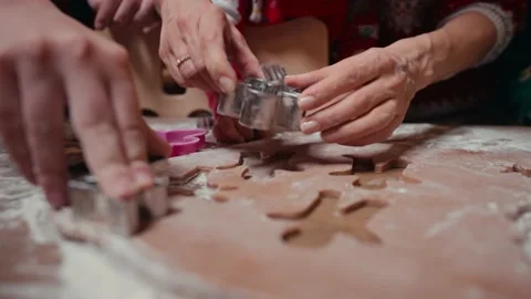 Cute children making cookies with mother on Christmas Day at home Stockbeeldmateriaal 168106853