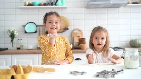 Cute childs having fun while cooking pie in kitchen Stock Footage 142574959