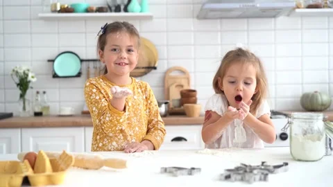 Cute childs having fun while cooking pie in kitchen Stock Footage 142575011