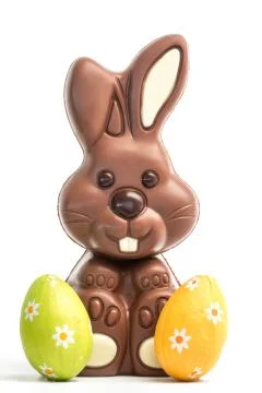 Cute chocolate bunny with two easter eggs Stock Photos