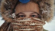 Cute Close-Up Portrait Of A Young Girl Covered Her Face With Knitted Hat Stock Footage