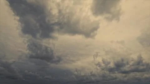 Cute cloudscape of sky with massive rain or snow clouds background Stock Photos