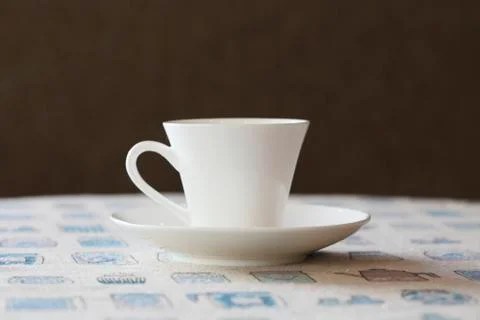 Cute coffee cup on table Stock Photos