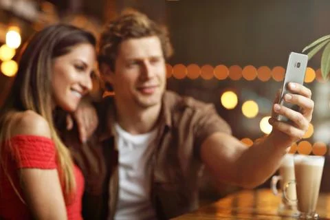 Cute couple on a date at the cafe Stock Photos