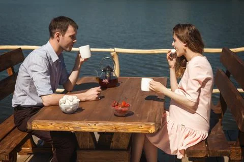 Cute couple drinking tea outdoors Stock Photos