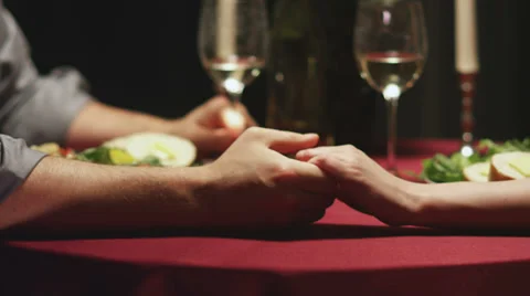 A cute couple have a candlelit dinner together Stock Footage 33873979