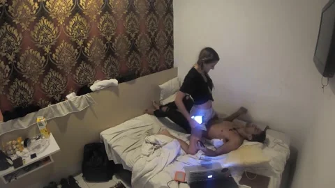 Cute Couple Scrolling Instagram Hyperlapse in Bedroom Using Technology Stock Footage 144047326