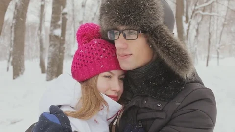 Cute couple in a snowy forest 스톡 동영상 73422985