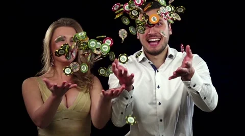 Cute couple throws chips in the air celebrating victory. Black Video stock 61180326