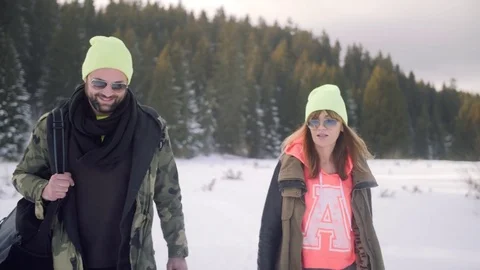 Cute couple walking in the snowy forest. Stock Footage 84138375