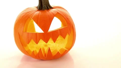 Cute creepy two pumpkins standing on heads with scary face carved out, glowin Stock Footage 272461204