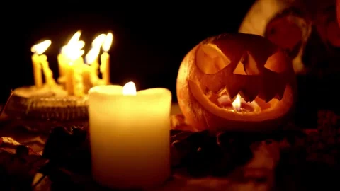 Cute creepy two pumpkins standing on heads with scary face carved out, glowin Stock Footage 272462108