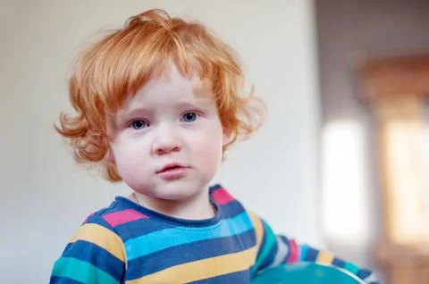 Cute curly-haired boy Stock Photos