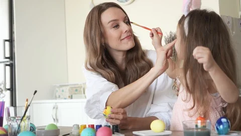 Cute daughter with mommy preparing for easter and play with each other Stock-Footage 127125844