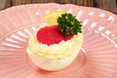 Cute deviled egg with strawberry topping Stock Photos