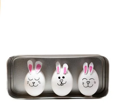 Cute Easter Bunny Eggs in Metal Tray on White Background-1 Stock Photos