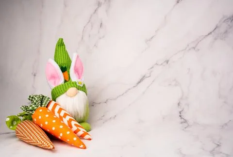 Cute Easter Gnome Bunny with Carrots on White Background Stock Photos