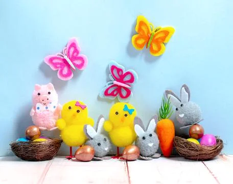 Cute Easter toy animals with Easter eggs Stock Photos