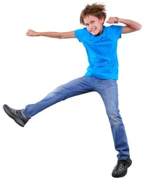 Cute elementary boy  jumping and dancing over white Stock Photos