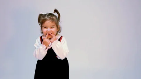 Cute Expressive Girl Claps Points To Face Stock Footage 97425697