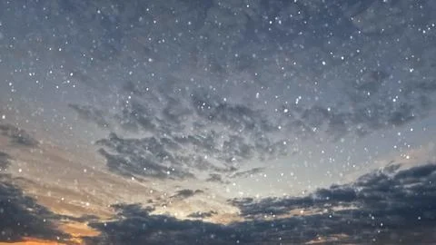 Cute fall of snow on clouds on sky background - photo of nature Stock Photos
