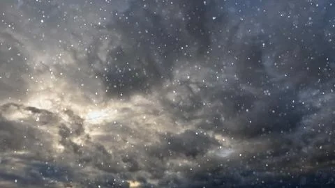 Cute fall of snow on clouds on sky background - photo of nature Stock Photos