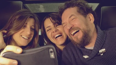 Cute family doing selfie inside car Stock Footage 76881582