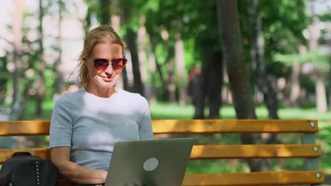 Cute female freelancer making remote work outdoors. Stockbeeldmateriaal 249134485