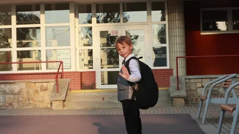 Cute first grade school child, going to school. First day at school for a f.. Stock Footage 315217133