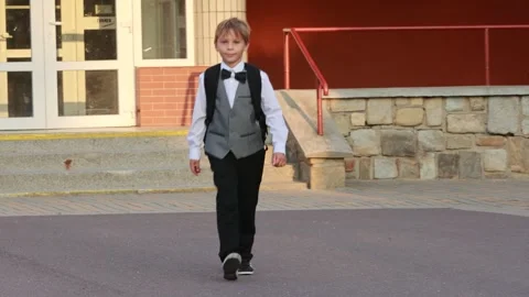 Cute first grade school child, going to school. First day at school for a f.. Stock Footage 315218408