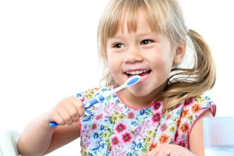 Cute five year old brushing teeth. Stock Photos