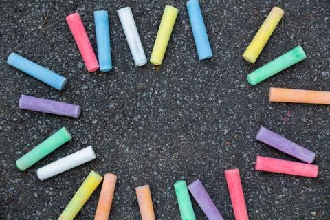 Cute frame or border with place for text in middle made with colorful chalks Stock Photos