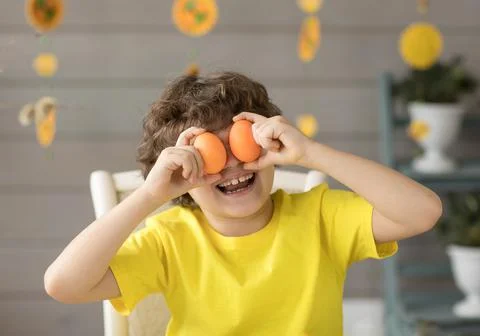 Cute funny little boy with Easter painted eggs, easter concept Stock Photos