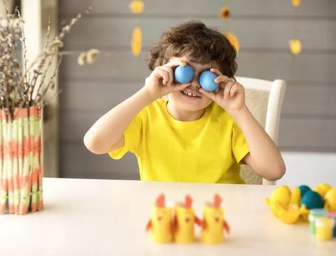 Cute funny little boy with Easter painted eggs, easter concept Stock Photos