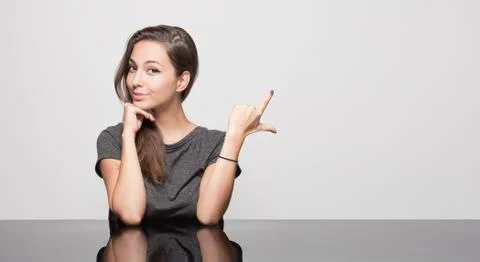 Cute gesturing brunette. Stock-Fotos