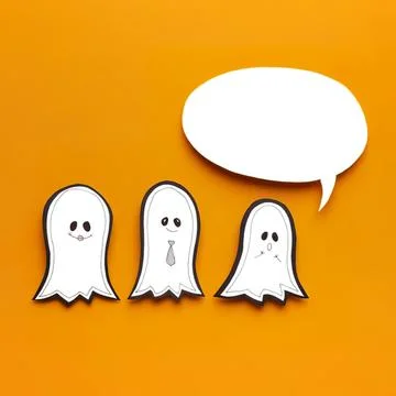 Cute ghost paper crafts with speech bubble on orange background Stock Photos