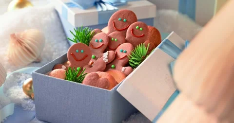 Cute gingerbread men rest in light blue present boxes. Stock Footage 346059698