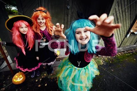 Cute girl in blue wig frightens people Stock Photos