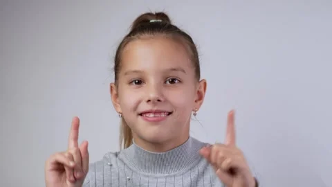 Cute girl dancing, smiling looking at camera, close-up. Child with dental b.. 動画素材 289829357