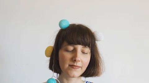 Cute girl easter portrait with egg lights on head Stock Footage 126856860