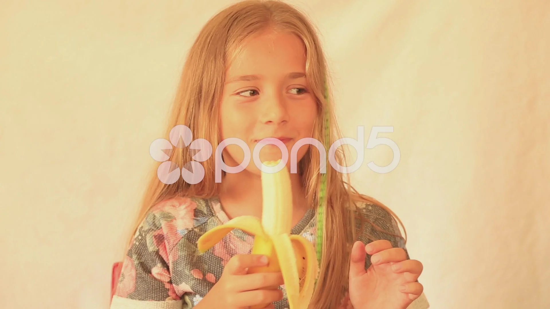 girl eating banana
