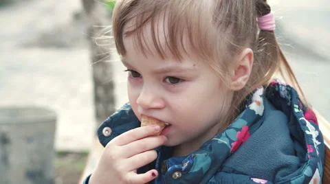 Cute girl eats a ice cream Stock Footage 62560928