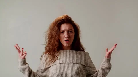 A cute girl is experiencing a brain explosion from emotional overload or Stock Footage 253627668